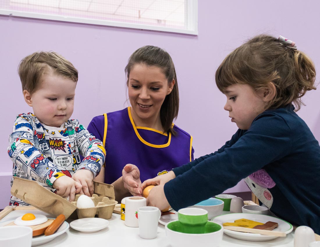 Children role playing tea time